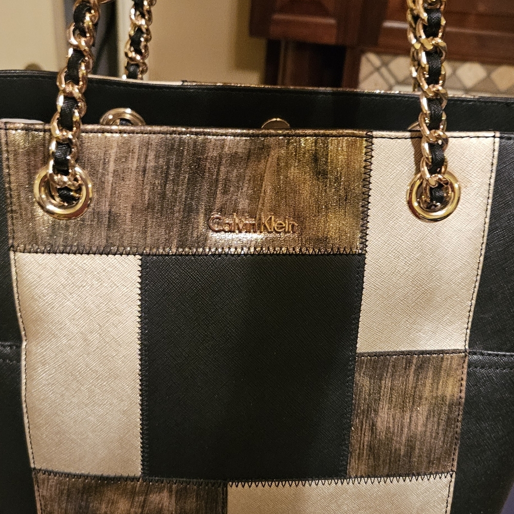 Calvin Klein purse..NWOT. NEW ORIGINAL DUST BAG BLACK WITH PATCHWORK ON FRONT